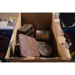 A box containing various tins, fittings etc.