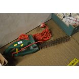 An electric hedge trimmer