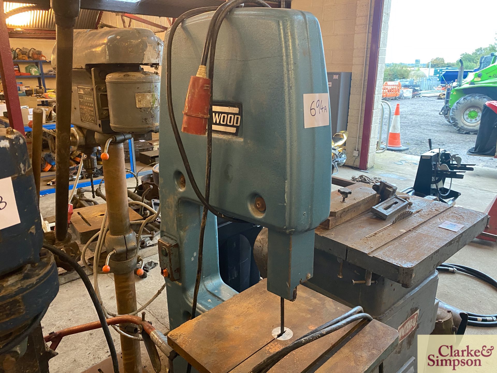 Evenwood band saw on stand.