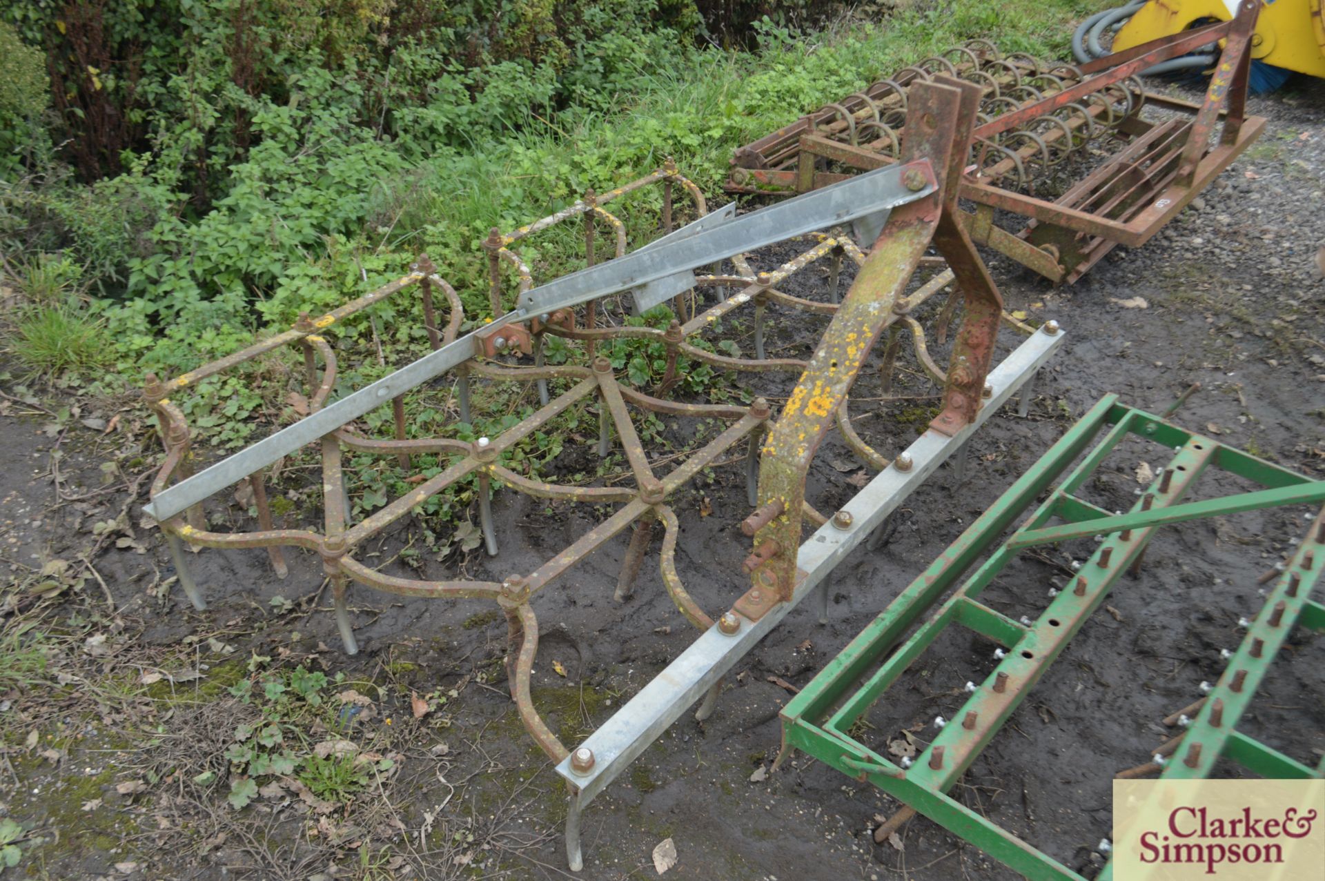 Linkage mounted two gang seed harrow.