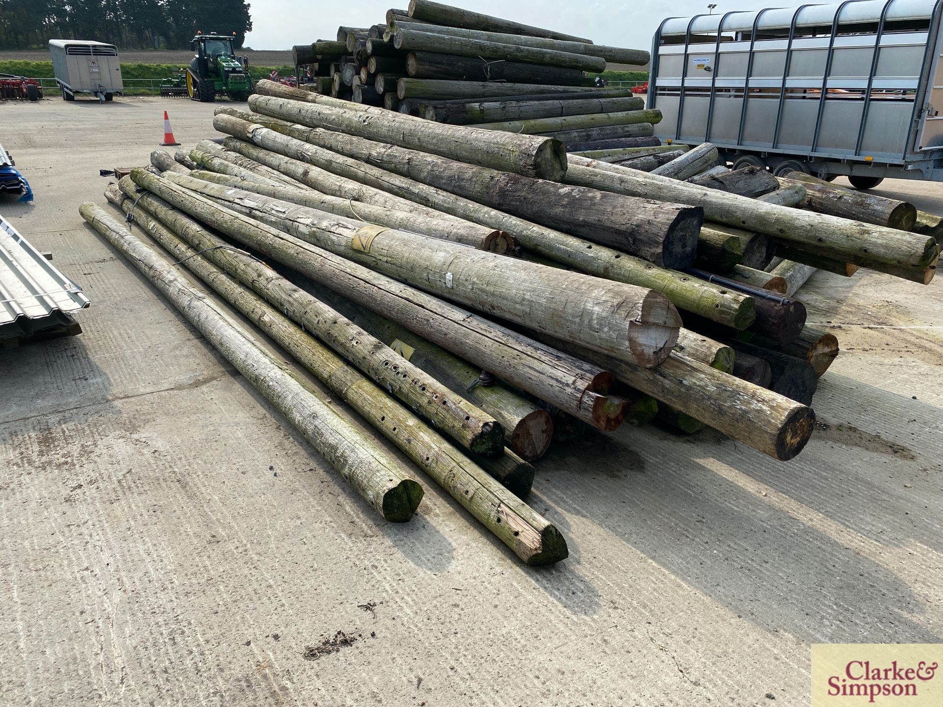 c. 40 telegraph poles of varying sizes. Approximately 28ft in length. * [Located Roudham]