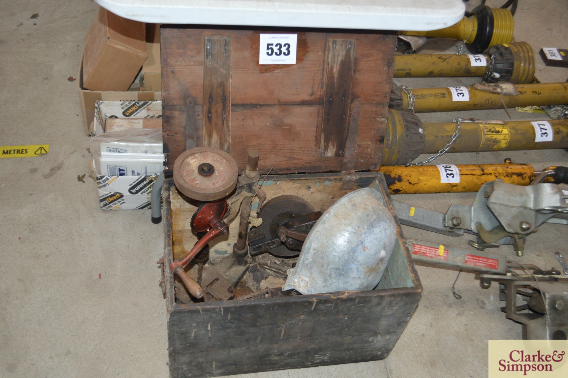 Wooden box with various tools.