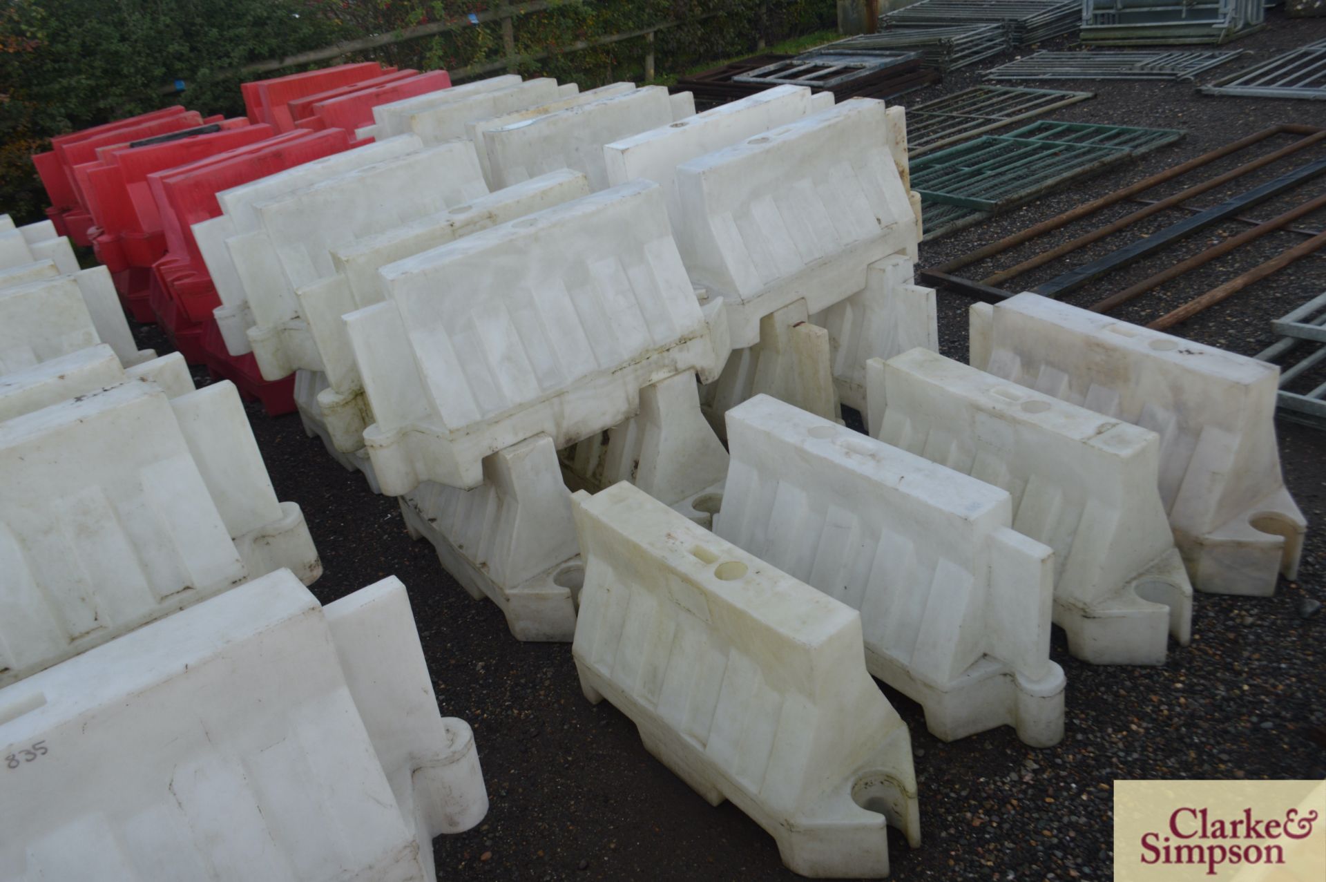 Large quantity of water filled traffic barriers. *