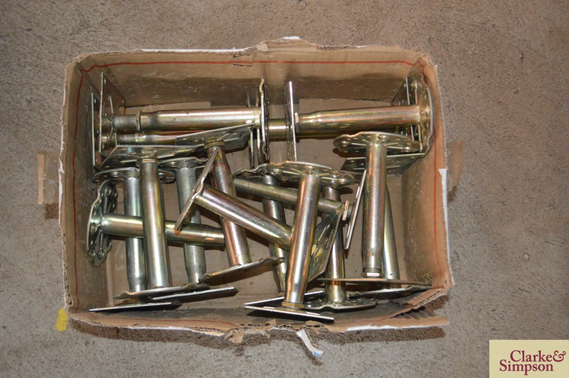 Box of small metal stands.