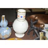 A large cream glazed jug with snake decoration, re