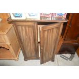A mahogany two door side cupboard