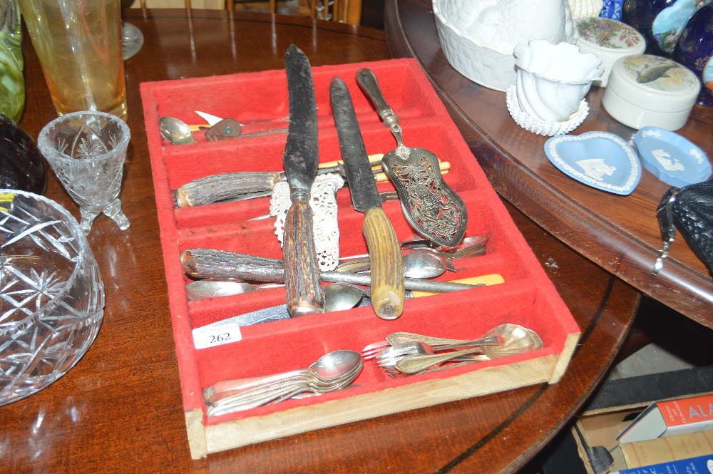 A cutlery tray and contents to include a carving s