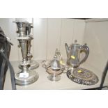 A pair of silver plated candlesticks; silver plate