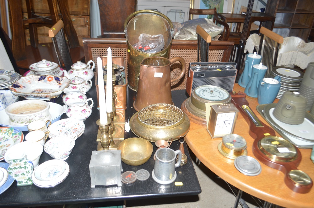 A brass coal scuttle; two pairs of brass candle st