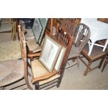 Two oak spindle back and rush seated chairs
