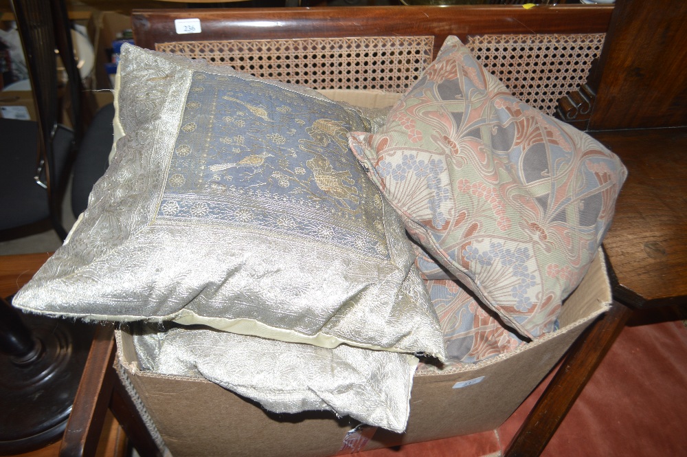 A box of various cushions - some in the Art Nouvea