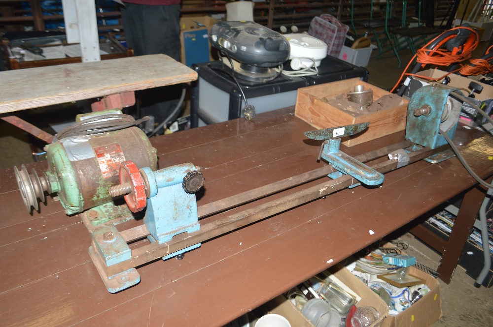 A lathe and various accessories including chucks e