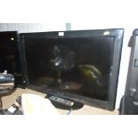 A Panasonic flat screen television with remote con