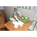 A graduating set of three duck ornaments; and a tureen