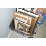 A box of various pictures and frames