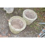 A pair of concrete garden planters