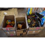 Three boxes containing various toys