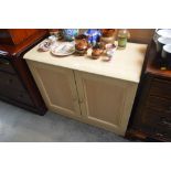 A beech effect side cupboard