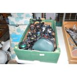 A box of various fishing reels