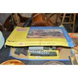 A box of Hornby trains and accessories