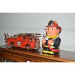 A small metal model of a fire engine; and a novelt