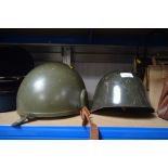 Two military helmets