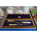 A three piece carving set in fitted box