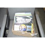 A box containing West Wing season 1 - 6; and a qua