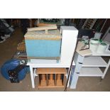 A linen basket; a white painted table; CD rack; wa