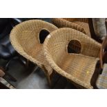 A pair of wicker chairs