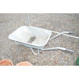 A galvanised wheelbarrow