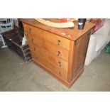 A light oak chest fitted four long drawers