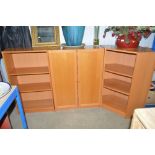 A modern beech effect three piece cabinet and book