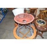 A retro glass top circular table