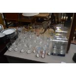 A quantity of various drinking glasses