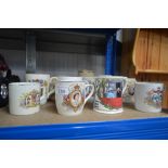 A collection of commemorative mugs
