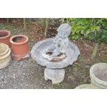 A concrete garden water feature