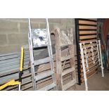 An aluminium step ladder; and a wooden step ladder