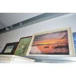 Two large prints; one depicting a sunset; a st