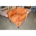 A brown leather armchair