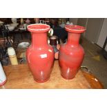 A pair of modern red glazed vases