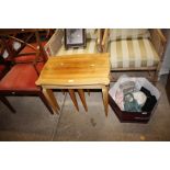 A nest of three teak occasional tables