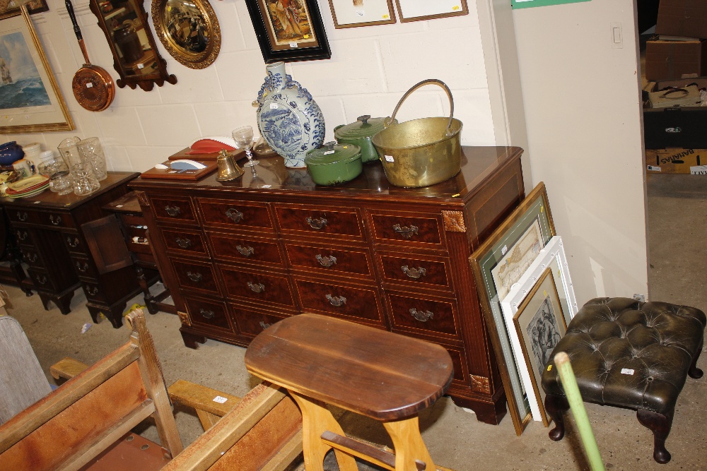 A reproduction mahogany sideboard centred with two