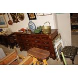 A reproduction mahogany sideboard centred with two