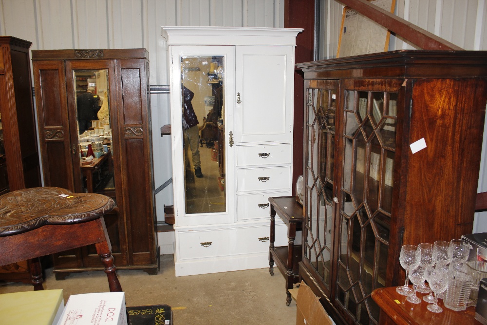 A white painted mirrored door compactum wardrobe f