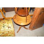 A modern pine circular topped table