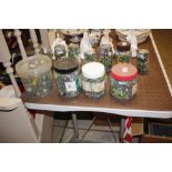 Four large containers of various glass marbles