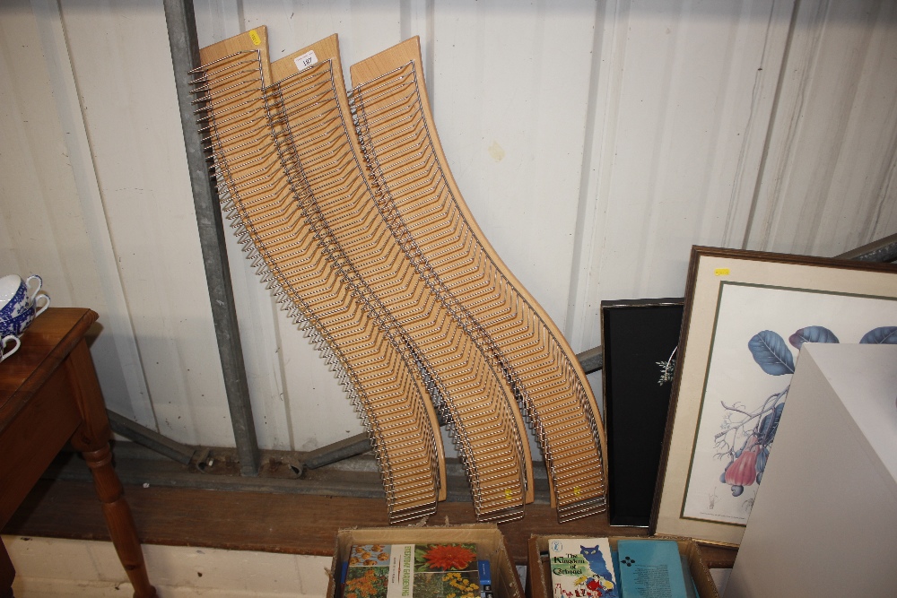 Three CD racks of wavy form