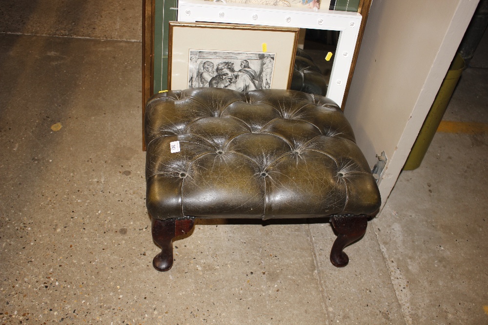 A mahogany and green leather button down stool