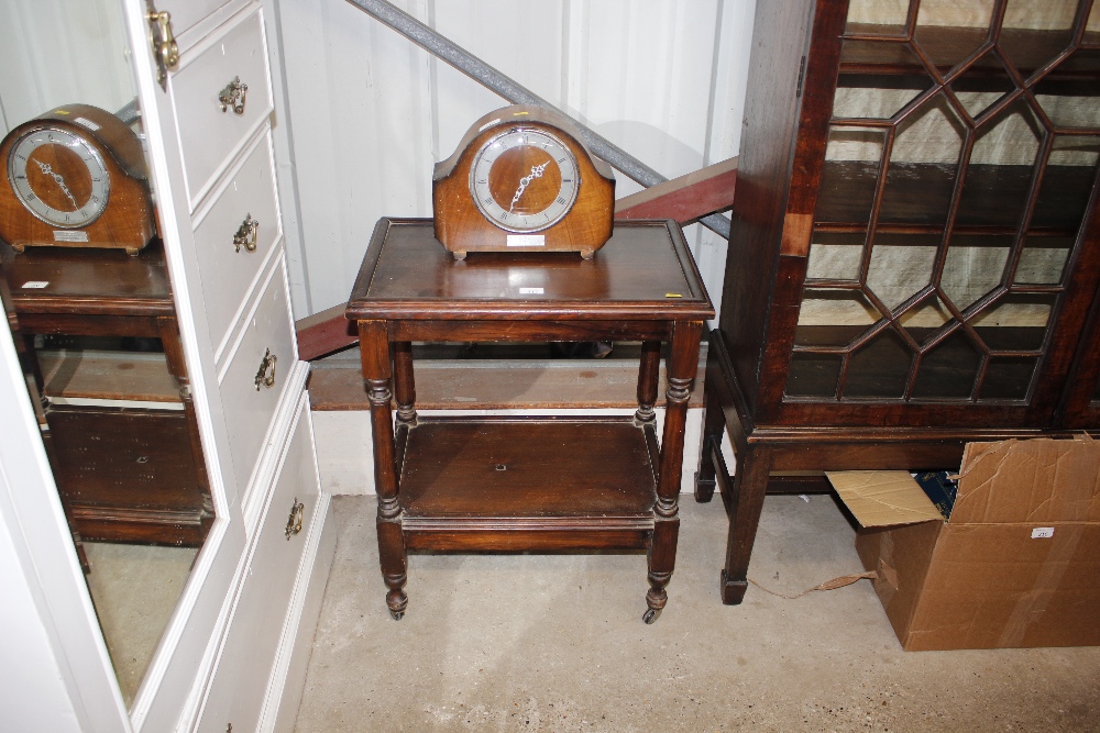 A stained pine two tier trolley